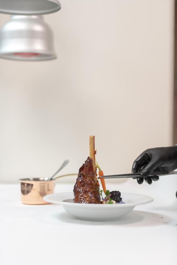 The View Bouznika Hotel Exterior photo A chef preparing a dish
